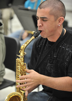 Saxophonist Julian Sutherland rehearses for jazz concerts. 