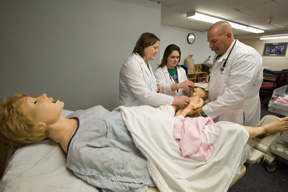 JoAnne Pearce, Jennie Brumfield, and Vernon Kubiak, College of Technology nursing faculty, are demonstrating the use of the 