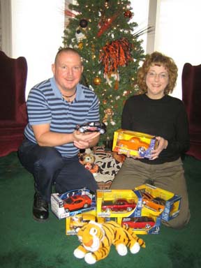 Casey Thompson, left, and Nancy Lovgren, of the ISU Alumni Association, with models donated to 'Toys for Tots'