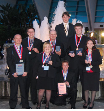 Front Row: Eugene Manalo, Loran Whited, Zach Ellis, Kimberly Wright. Back Row: Cody Snooks, Jess Ward, Stephen Flatten, Thomas Knorr.