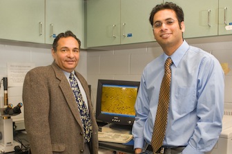 Alok Bhushan, ISU pharmaceutical science professor, left, with recent ISU doctoral graduate Vikas Bhardwaj who is heading to engage in lung cancer research at the MD Anderson Cancer Center.