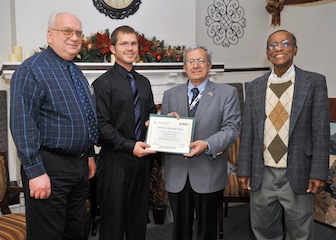 From left, Gene Stuffle, Chris's Advisor; Chris Larsson; Hossein Mousavinezhad, electrical engineering chair; andSubbaram Naidu, director for the School of Engineering. 