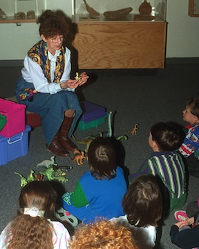Rebecca Thorne-Ferrel, in 1996, teaching children about dinosaurs, one of her favorite activites. (ISU Photographic Services)