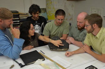 Most of the authors of the paper. Left to right: Jason Ramsay, Cheryl Wilga, Alan Pradel, Robert Schlader, Jesse Pruitt and Leif Tapanila working on the CT specimen of Helicoprion. (Photo by Ray Troll) 