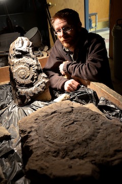 Leif Tapanila with two of the largest Helicoprion whorls in the world. (Photo by Ray Troll)