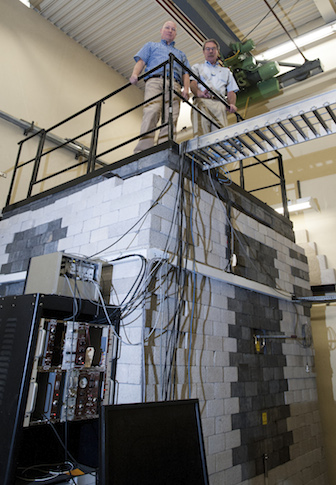 Chad Pope, left, and George Imel at ISU's reactor laboratory.