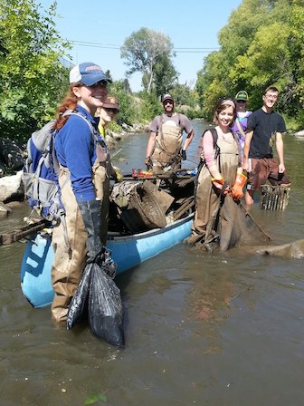 Volunteers associated with the ISU Stream Ecology Center with some of the debris they collected during the Clean the Portneuf 2014.