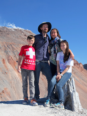 Crosby family on the rim of the still-steaming Chaitén Caldera which erupted in 2008 in south central Chile.  Associated landslides partially destroyed the small city of Chaitén. 