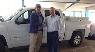 Paul Link and Brad Thompson with one of the donated trucks.