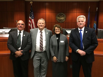 ISU Meridian's Bessie Katsilometes with Ada County commissioners Rick Yzaquirre (left), Dave Case (middle), and Jim Tibbs (right).