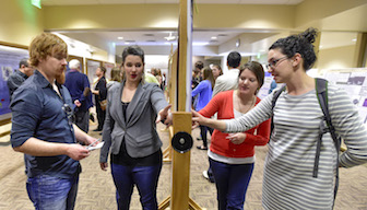 Students at poster session. 