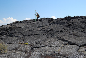 Researcher at the Craters of the Moon last summer participating in FINESSE study. (Courtesy of Scott Hughes)