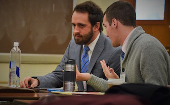 The ISU team consulting during one of its debates at the Ohio University.