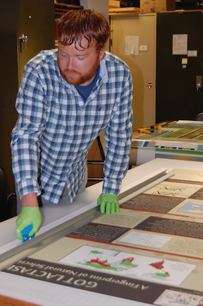 Curt Schmitz works on the IMNH's new exhibit 