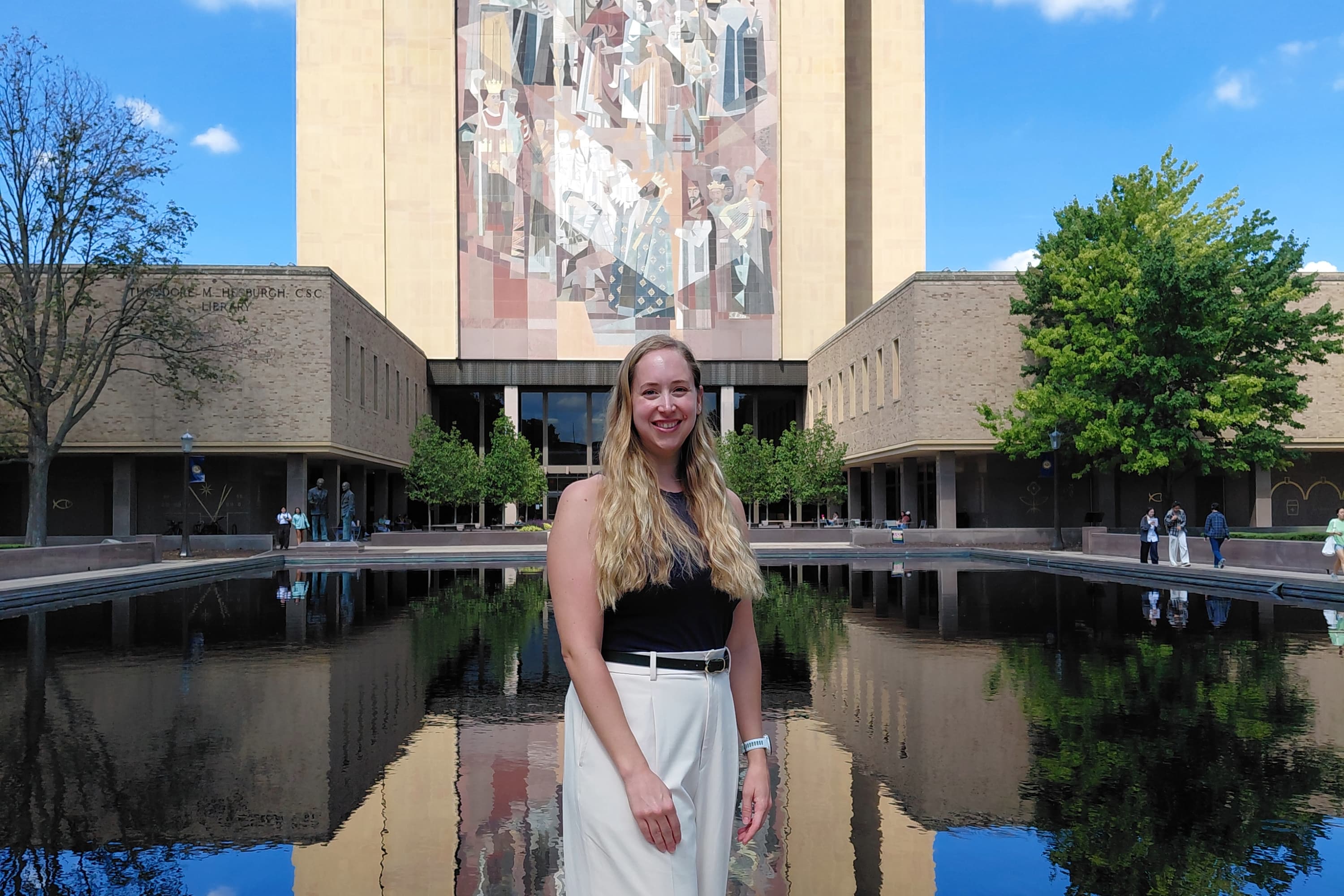 Meghan Woolley in front of building